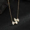 A light luxury golden collarbone chain supply, featuring a female mother-of-pearl necklace decorated with diamonds and a bow pendant details Picture